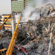 Firefighters at the scene after the collapse of the Plasco building in Tehran. Photo: AP